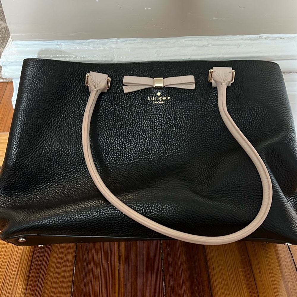 Kate Spade black leather purse with tan bow and handles